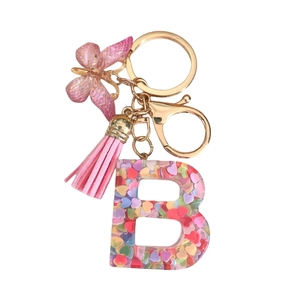 Resin letter B keychain with colorful heart sequins, pink tassel and butterfly charm