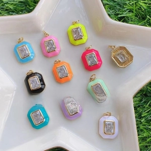 Detailed macro view of colorful enamel pendant charms for DIY jewelry making