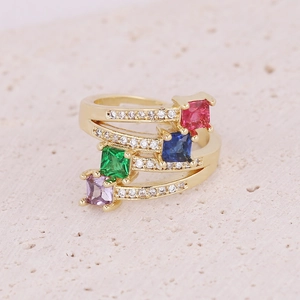 Gold multi-layer ring with colorful square stones and micro-paved zircons on stone surface