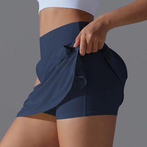 Detail view of navy blue high-waisted tennis skort with double-layer anti-exposure design