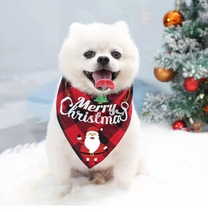 Close-up of a festive red and black plaid Christmas bandana on a dog in a holiday setting