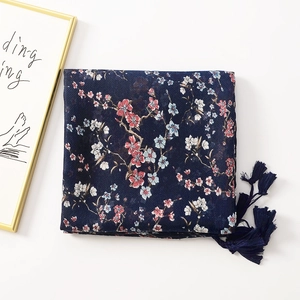 Navy blue floral cotton linen scarf with tassels and cherry blossom print on white background
