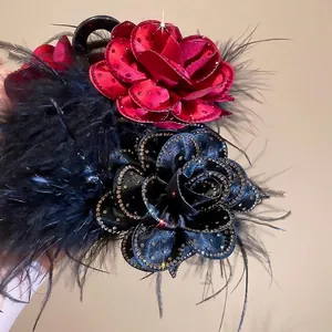 Elegant red and black rose hair claw clip with fluffy feathers and shiny rhinestones