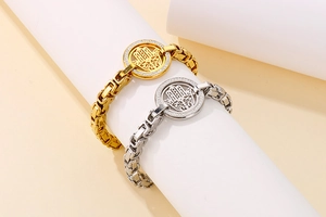 Detailed view of gold and silver Hamsa Hand bracelets with sparkling crystals and links