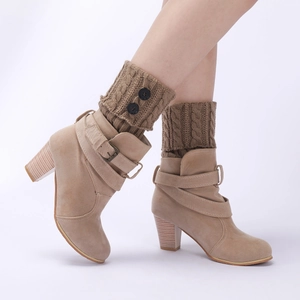 Detail of khaki suede ankle boots with knitted leg warmers and chunky high heels