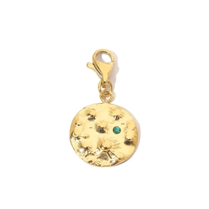 Detail of gold moon texture pendant with green zircon and lobster clasp on white background