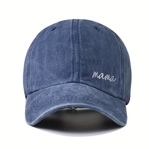 Detailed embroidery of MAMA text on washed denim blue vintage baseball cap