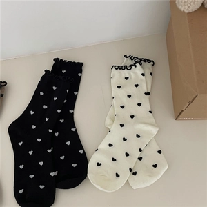Japanese style heart pattern socks with ruffled cuffs in black and off-white set