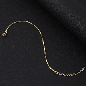 Detail of 18K gold plated stainless steel box chain bracelet with secure lobster clasp