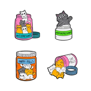 Set of 4 cute enamel cat pins in medicine bottles labeled Anti Depressants and Happy Pills
