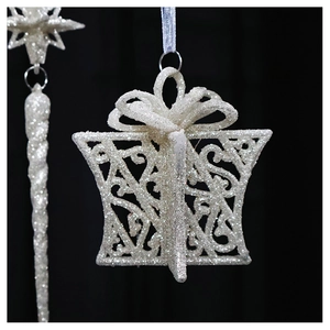 Close-up of white glitter gift box Christmas ornament with a 3D bow decoration