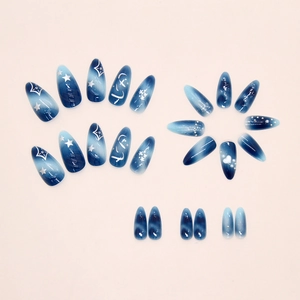 Macro shot of 24pcs almond press-on nails featuring blue gradient and starry sky pattern