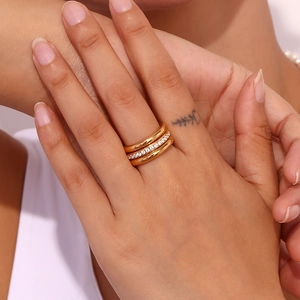 Three-piece stackable 18K gold plated stainless steel rings set with zircon accents