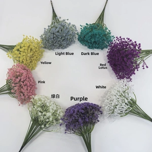 Top view of eight colorful artificial baby's breath bouquets arranged in a circular layout