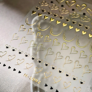 3D hollow gold and black heart nail stickers M-1092 featuring various minimalist patterns