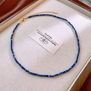 Detail of lapis lazuli beaded necklace with gold plated lobster clasp and extender