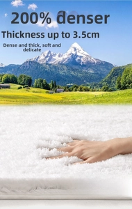 Vue macro détaillée montrant la texture en peluche de 3,5 cm du tapis de bain blanc