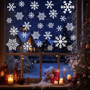 Detailed view of various white snowflake window stickers for Christmas home decoration