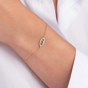 Elegant 925 sterling silver evil eye bracelet with blue zircon and gold finish on wrist