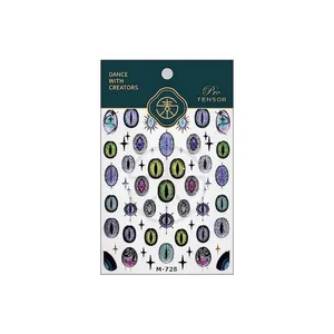 Glittery evil eye nail art stickers in various colors with metallic star accents