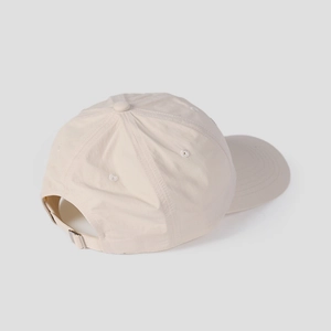 Detail view of the adjustable metal buckle and breathable nylon fabric on baseball cap