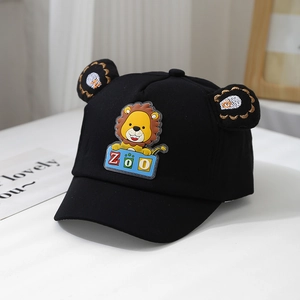 Close-up of black baby baseball cap with 3D ears and cute lion patch detail
