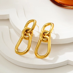 Chunky 18K gold plated stainless steel interlocking oval link earrings on a white stand