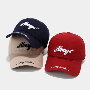 Embroidered cotton baseball caps in navy, beige, and red with stylish wide brims