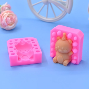 3D bear silicone mold for chocolate and baking with a finished party hat bear figure