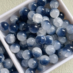 Close-up of 10mm blue and white cracked glass beads for DIY jewelry making