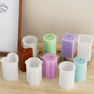 Selection of geometric silicone candle molds including heart and cylinder shapes