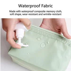 Waterproof light green makeup bag showing water-resistant composite memory fabric surface