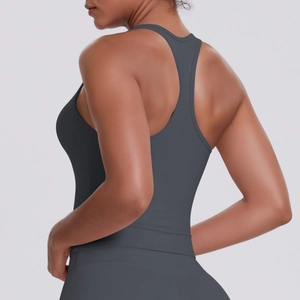 Detail of grey racerback sports vest showing breathable fabric and slimming athletic fit