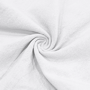 Macro shot of white linen fabric showing soft texture and natural vertical weave