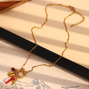 18K gold plated stainless steel necklace with red enamel lips and sea horse charms