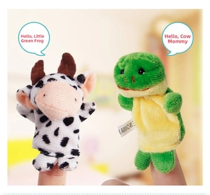 Detailed view of plush cow and frog finger puppets for kids in a soft home setting