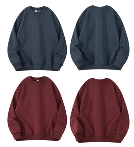Detail of ribbed cuffs and crew neck collar on thick cotton sweatshirts in various colors