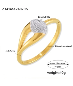 Detail shot of gold titanium steel bangle with geometric pavé diamond setting and size info