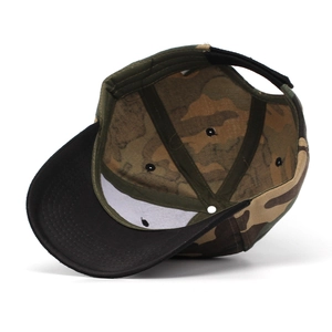 Detail view of the camouflage baseball cap interior with sweatband and adjustable strap
