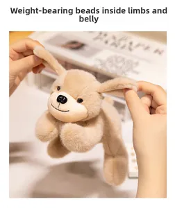 Detailed shot of soft plush puppy toy with weighted beads inside for a realistic feel