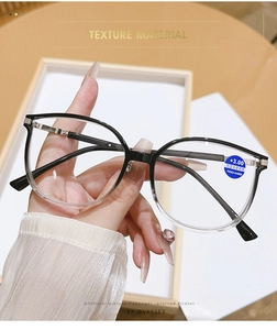 Close-up of +3.00 reading glasses with blue light filter and stylish gradient frame