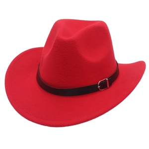 Close-up of a red wool felt cowboy hat with a black leather band and silver buckle