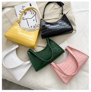Detailed flat lay of hobo bags showing five colors and faux crocodile texture