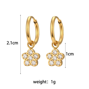 Detail view of 18K gold-plated flower earrings with sparkling cubic zirconia crystals