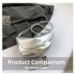 Silver crescent underarm bag with glossy leather texture and stylish fold details