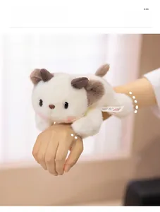 Close-up of a plush animal wristband with soft white fur and cute brown ears and horns