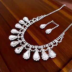 Luxurious geometric fringe necklace and drop earrings set with sparkling rhinestones