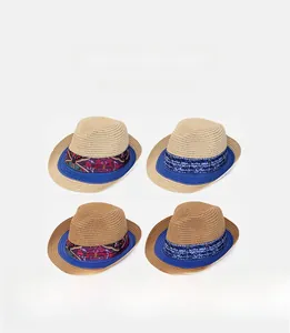 Detail of four straw fedora hats with ethnic patterned bands and blue brim piping