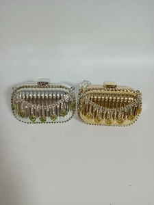 Front view of evening clutch bags with rhinestone fringe and heart charms in gold and silver