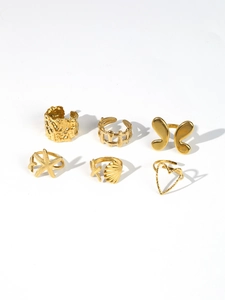 Detailed set of 18k gold-plated jewelry featuring butterfly, starfish, and heart designs